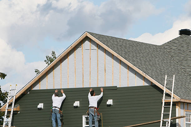 Professional Siding technician working in Melrose, MA